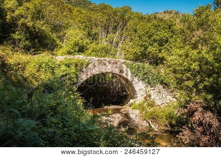 Genoese Stone Arch Bridge In Balagne Region Of Corsica