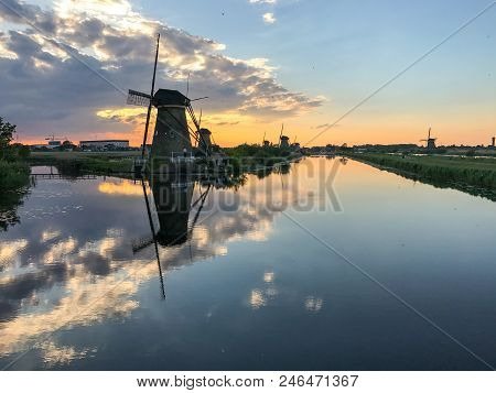Beautiful Dutch Windmill Landscape At The Famous Kinderdijk Canals, Unesco World Heritage Site
