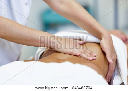 Woman Having Abdomen Massage By Professional Osteopathy Therapist