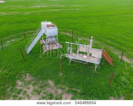 A Tank With Methanol Near The Oil Well. Equipment Of An Oil Well. Shutoff Valves And Service Equipme