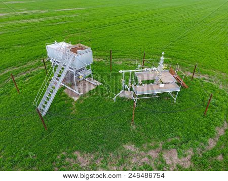 A Tank With Methanol Near The Oil Well. Equipment Of An Oil Well. Shutoff Valves And Service Equipme