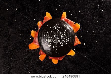 Delicious Burgers Of Black Dough With Jamon Serano And Vegetable On Dark Background.