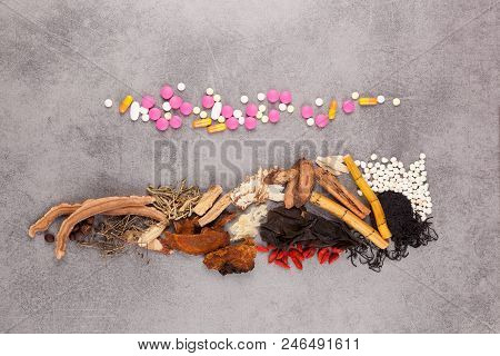 Western And Traditional Chinese Medicine On Gray Background.