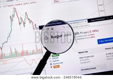 Montreal, Canada - June 20, 2018: Augur Crypto Currency Price Under Magnifying Glass. Cryptocurrency