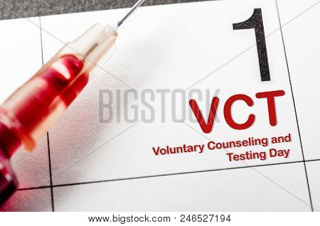 Voluntary Counseling And Testing Day With Blood In Tube And Syringe On Calendar.