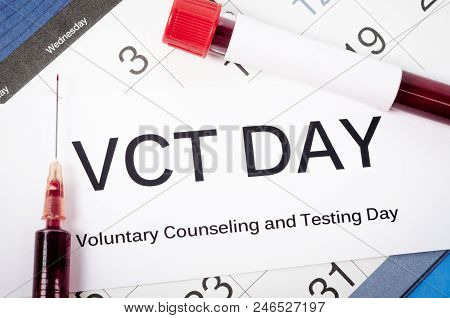 Voluntary Counseling And Testing Day With Blood In Tube And Syringe On Calendar.