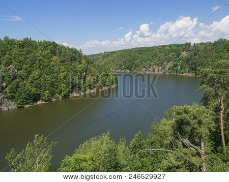 View From Bridge Zvikov On Otava And Vltava River With Green Tree Forest Rocky Shore Blue Water, Boa