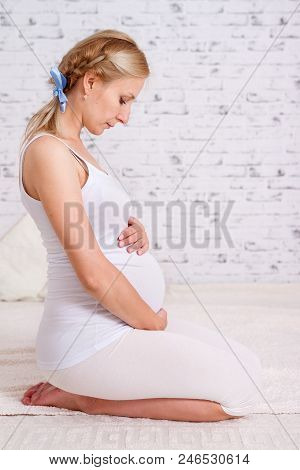Beautiful Pregnant Adult Woman On White Bacground