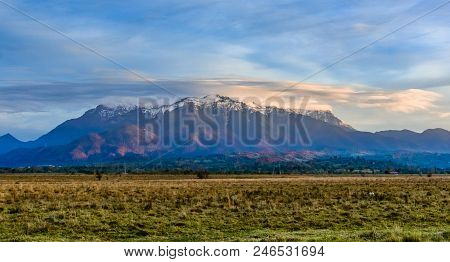 Bucegi Mountains, Brasov, Romania: Landscape View In The Sunset Light Of The Snowy, Bucegi Mountain,
