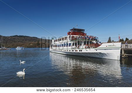 South Lakeland, Uk - April 2018: Bowness Pier With Boats For Hire And Tourist Cruises At Bowness-on-