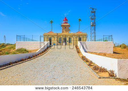 Front View Of Architecture Of Lagos Lighthouse Or Farol Ponta Da Piedade Atop The Spectacular Cliffs