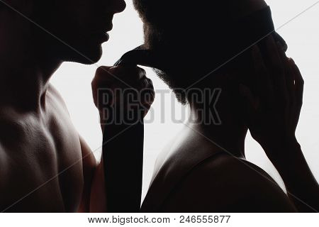 Partial View Of Silhouettes Of Sexy Couple With Cloth