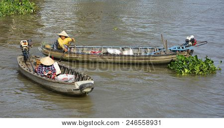 Phong Dien, Vietnam - December 31st 2017. Two Market Vendors In Their Boats At The Phong Dien Floati