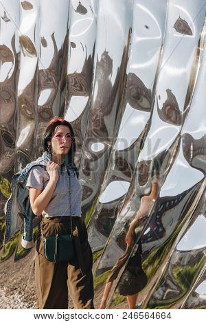 Wroclaw, Poland - 18 May 2018: Beautiful Young Woman In Front Of Sculpture Made Of Reflective Materi