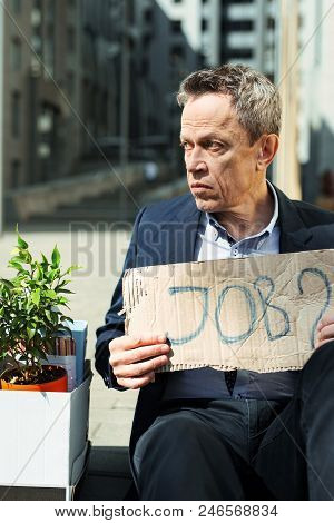 Searching Job. Brokenhearted Fired Elderly Wrinkled Man Feeling Very Awful While Searching Job Outsi