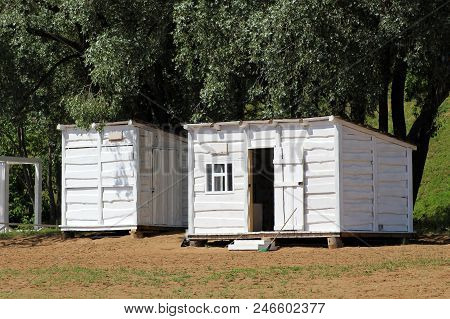 Beautiful Small Bathing Houses On Yellow Sandy Beach