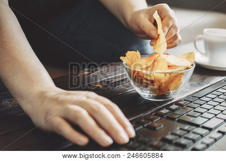 Compulsive Overeating, Mindless Snacking, Junk Food, Unhealthy Meals. Woman Eating Chips From Bowl A