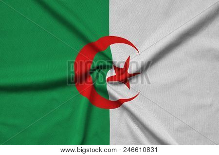 Algeria Flag  Is Depicted On A Sports Cloth Fabric With Many Folds. Sport Team Waving Banner
