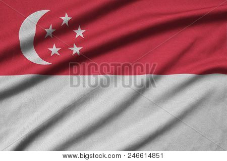 Singapore Flag  Is Depicted On A Sports Cloth Fabric With Many Folds. Sport Team Waving Banner