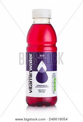 London, Uk - June 23, 2018: Bottle Of Glaceau Vitamin Water Drink With Pomegranate & Blueberry On Wh