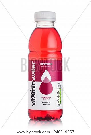 London, Uk - June 23, 2018: Bottle Of Glaceau Vitamin Water Drink With Raspberry & Apple On White Ba