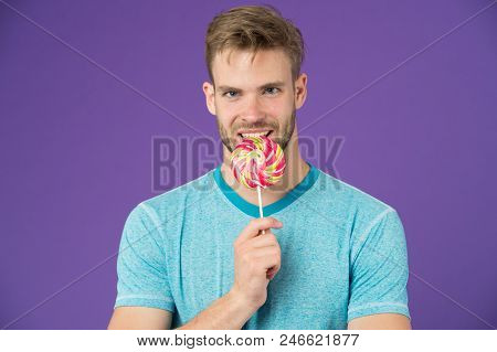 Who Cares About Diet. Man Bites Big Sweet Lollipop. Man With Bristle Likes Sweets. Spoiled Diet. Spo