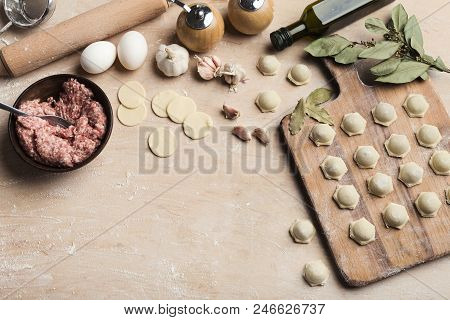 Raw Homemade Dumplings At Cutting Board. Preparation Of Traditioan Ukrainian Food.