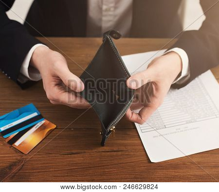 Man Showing Empty Wallet Without Cash, Using Only Credit Cards. Modern Lifestyle, Lack Of Money In E