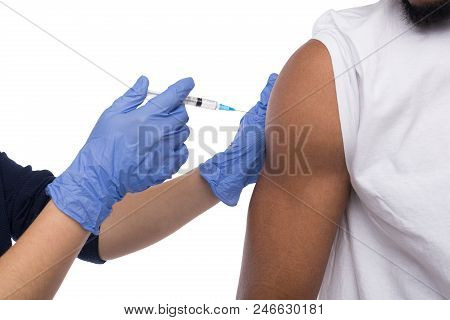 Doctor Making Vaccination Ingection, Isolated On White. Medicine And Healthcare Concept