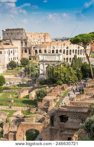 Ancient Arch Of Titus On The Roman Forum Against Colosseum, Rome, Italy, Europe