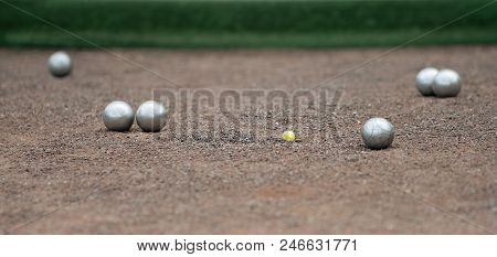 Metallic Petanque Four Balls And A Small Wood Jack