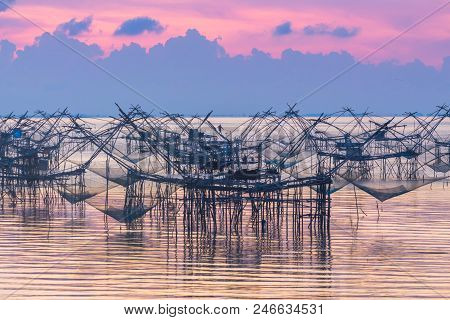 Golden Sky Above Fishing Trap In Pak Pra Talay Noi Sea Phatthalung South Of Thailand