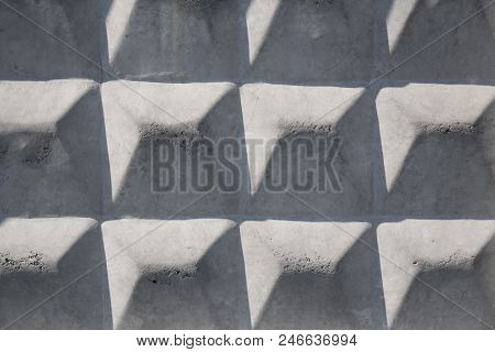 Texture Of Embossed Concrete Slab In The Inclined Rays Of The Sun