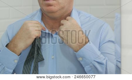 Businessperson Image Reflected In The Bathroom Mirror Untie A Tie Knot