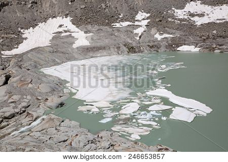 Rhone glacier, source of Rhone river, melting and retreating due to global warming. Rhone glacier is loosing up to 2 meters in length every year.