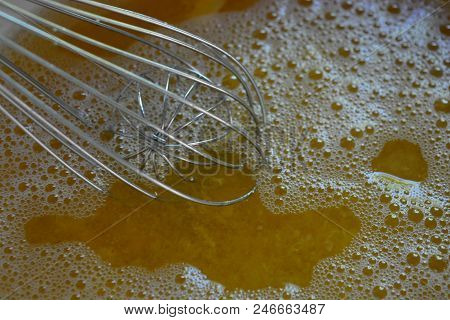 Metal Kitchen Whisk In A Fruit Apricot Broth, A Kampot From Fresh Apricot For Fruit Jelly.