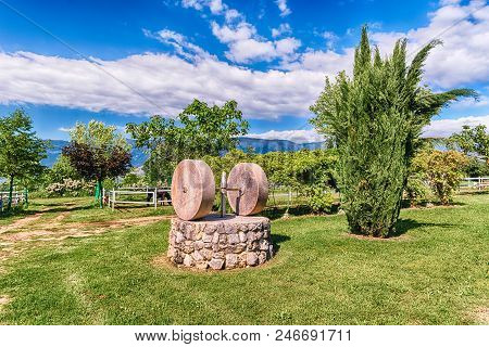 Ancient Olive Press With Two Millstones In The Countryside