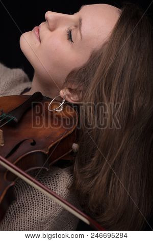 Passionate Violin Musician Playing On Black Background