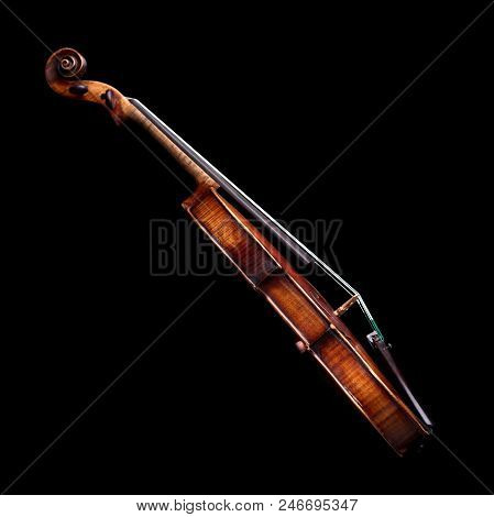 Side View Of A Baroque Violin Isolated On Black Background