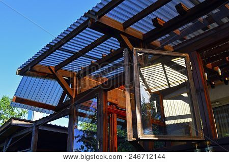 Structure Of A Wooden House With A Translucent Roof