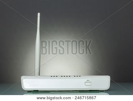 A Router With Wps Function On Gray Background