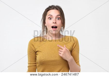 Happy Woman Pointing Fingers At Herself. Select Me Please Concept. She Can Not Believe In Her Luck