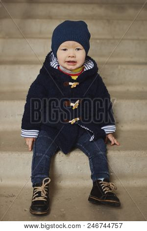 Fashoin Baby Boy Sitting  On The Stairs