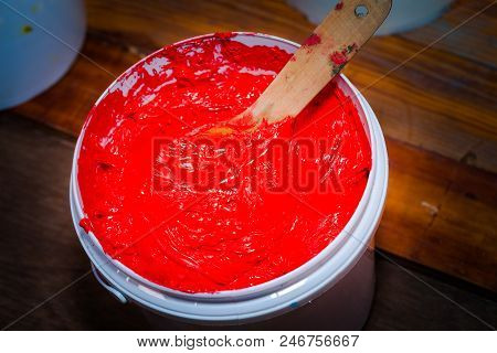 blue color of plastisol ink in white plastic barrel. plastisol ink is specially for print on tee shi