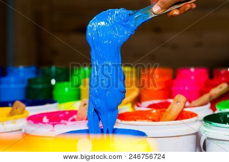 Blue Color Of Plastisol Ink In White Plastic Barrel. Plastisol Ink Is Specially For Print On Tee Shi