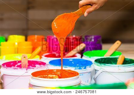 blue color of plastisol ink in white plastic barrel. plastisol ink is specially for print on tee shi