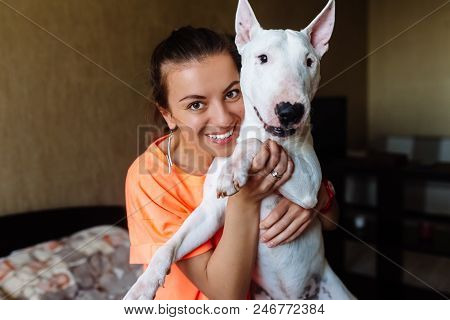 Cute Girl Petting Her Dog.beautiful Girl Having Fun With Her Dog And Enjoying Herself.girl And Her D