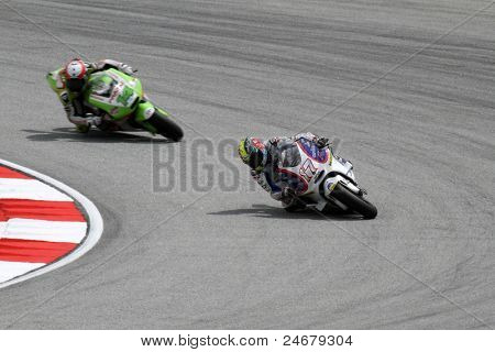 SEPANG, Malezja - 22 października: Zawodnicy MotoGP Karel Abraham (17) i Randy de Puniet (14) wyścigi na th