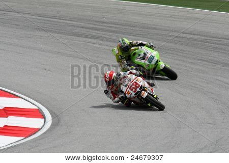 SEPANG, Malezya - 22 Ekim: MotoGP biniciler Marco Simoncelli (58) ve Loris Capirossi (65) at yarışları