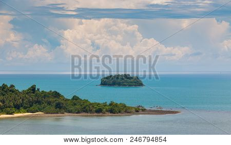 Island Sea View On Bright Blue Beach From Tropical. Clouds On Horizon And Some Storm Clouds. Outdoor